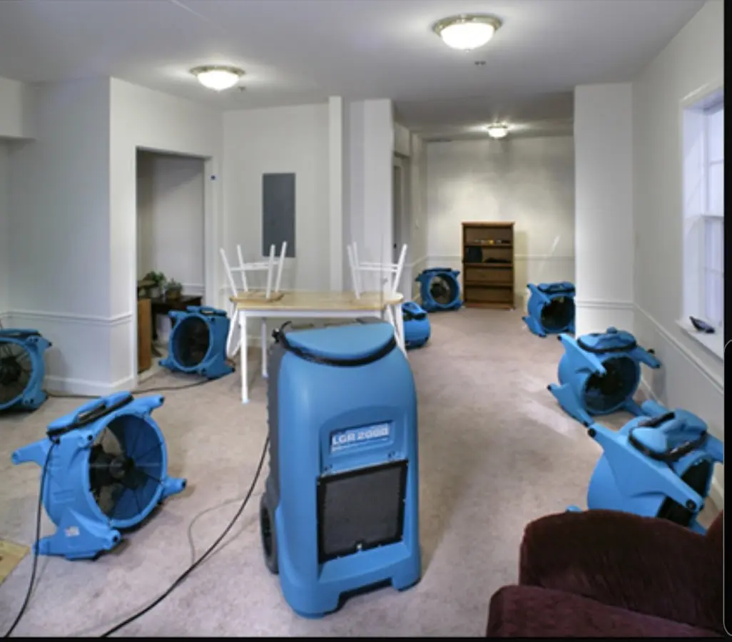 Air movers and dehumidifier setup for Water Damage Restoration in Hudson